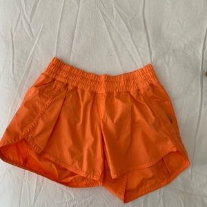 Orange Lulu running shorts